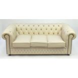 Cream leather three seater Chesterfield setee with button back upholstery, 70cm high x 190cm wide