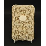 Good Chinese Canton ivory card case, deeply and finely carved with flowers, the reverse with figures