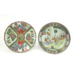 Two Chinese porcelain Canton plates, both hand painted in the famille rose palette with figures