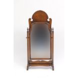 Victorian walnut swing mirror with urn shaped finials, 91cm high x 43cm wide