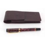 Parker red marbleised fountain pen with 18k gold nib, gold coloured bands and case