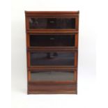 Globe Wernicke mahogany four section book case, labels to the interior, 143cm high x 87cm wide x