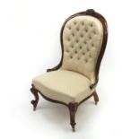 Victorian carved walnut ladies chair with cream button back upholstery 100cm high