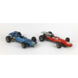 Two Schuco clockwork racing cars comprising Ferrari 320PS and Matra-Ford 430PS examples, the largest