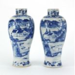 Pair of Chinese blue and white baluster vases, both hand painted with figures and a river landscape,