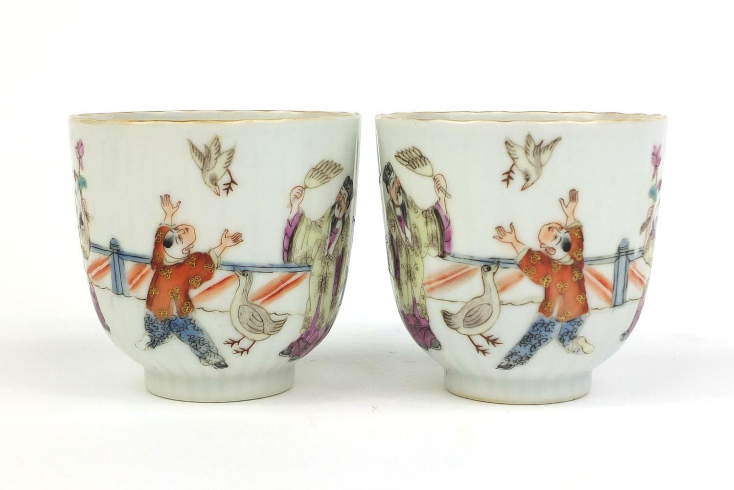 Pair of Chinese porcelain tea cups, hand painted in the famille rose palette with court figures - Image 9 of 11