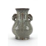 Chinese mottled glazed vase with rams head handles, character marks to the base, 17cm high