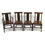 Four Victorian oak chairs to include a carver, the slats carved with figures, each 92cm high