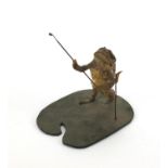 Taxidermy interest toad in the form of a golfer, 20cm high