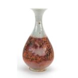 Chinese pottery red under glazed yuhuchun vase, 24cm high There is some general crazing o the glaze,