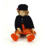 1930's Norah Wellings felt doll wearing and orange dress, black overcoat and hat, 53cm in length