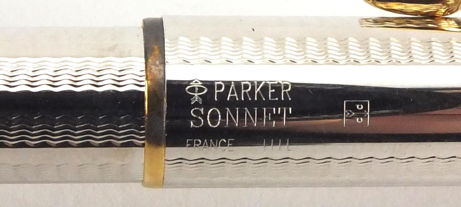 Parker Sonnet ballpoint pen and propelling pencil, both with engine turned decoration and with case - Image 2 of 2