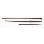 Tribal interest wooden staff carved with a clenched fist pommel, woodens pear and a metal spear