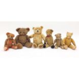 Six antique and later bears including straw filled examples and a Chad Valley hygienic example,