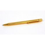 Cartier gold plated ballpoint pen with two refills, the pen numbered 486556