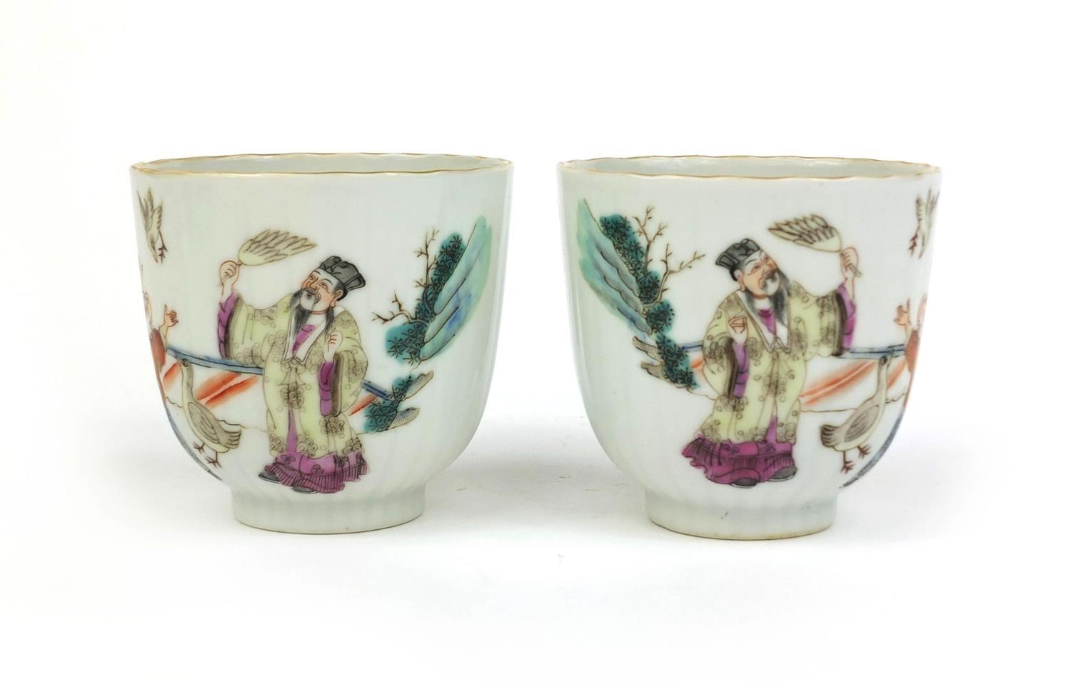 Pair of Chinese porcelain tea cups, hand painted in the famille rose palette with court figures - Image 7 of 11