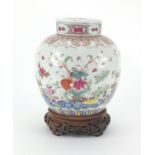 Chinese porcelain ginger jar and cover on carved rosewood stand, the jar finely hand painted in