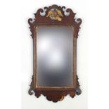 Georgian walnut mirror with gilded bird crest, 81cm x 45cm