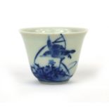 Chinese blue and white porcelain tea bowl, hand painted with birds amongst flowers and foliage,