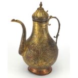 Turkish gilt copper water jug, engraved with flowers, 35cm high : For further condition reports