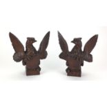 Pair of carved wooden phoenixes with heraldic shields on square bases, each 23.5cm high : For