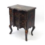 Chinoiserié black lacquered serpentine fronted two drawer chest, decorated with figures on horse