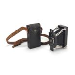 Vintage Ensignette De Luxe folding camera made by Houghtons of England, with leather case, patent
