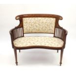 Edwardian inlaid mahogany two seater salon settee with cram floral upholstery, inlaid with swags,