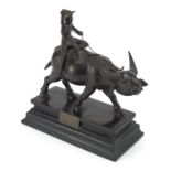 Bronze study of a China man riding a water buffalo, mounted on a rectangular wooden base with