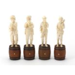 Four 19th century Dieppe carved ivory musicians including a conductor, each standing upon ebonised