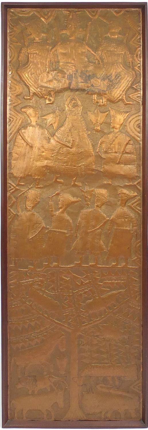 Large African copper panel embossed with tribesman, animals and insects, housed in a hard wood