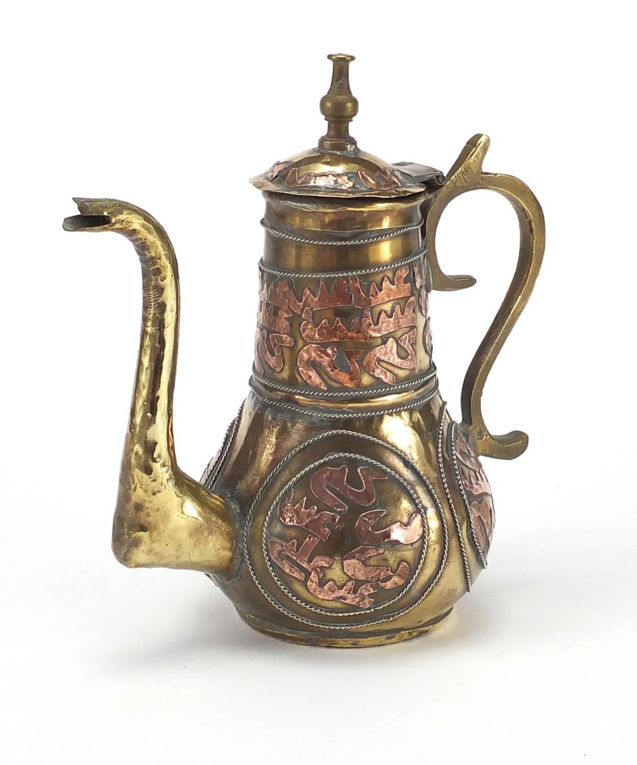 Middle Eastern brass and copper coffee pot, 22cm high : For further condition reports please visit