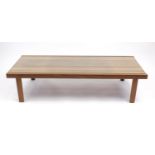 Mcintosh & Co teak coffee table with inset glass top, label to the underside, 140cm wide : For