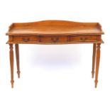 Hardwood serpentine fronted serving table with three drawers, 76cm high x 120cm wide x 43cm deep :