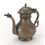 Middle Eastern copper water jug embossed with flowers and script, 28cm high : For further