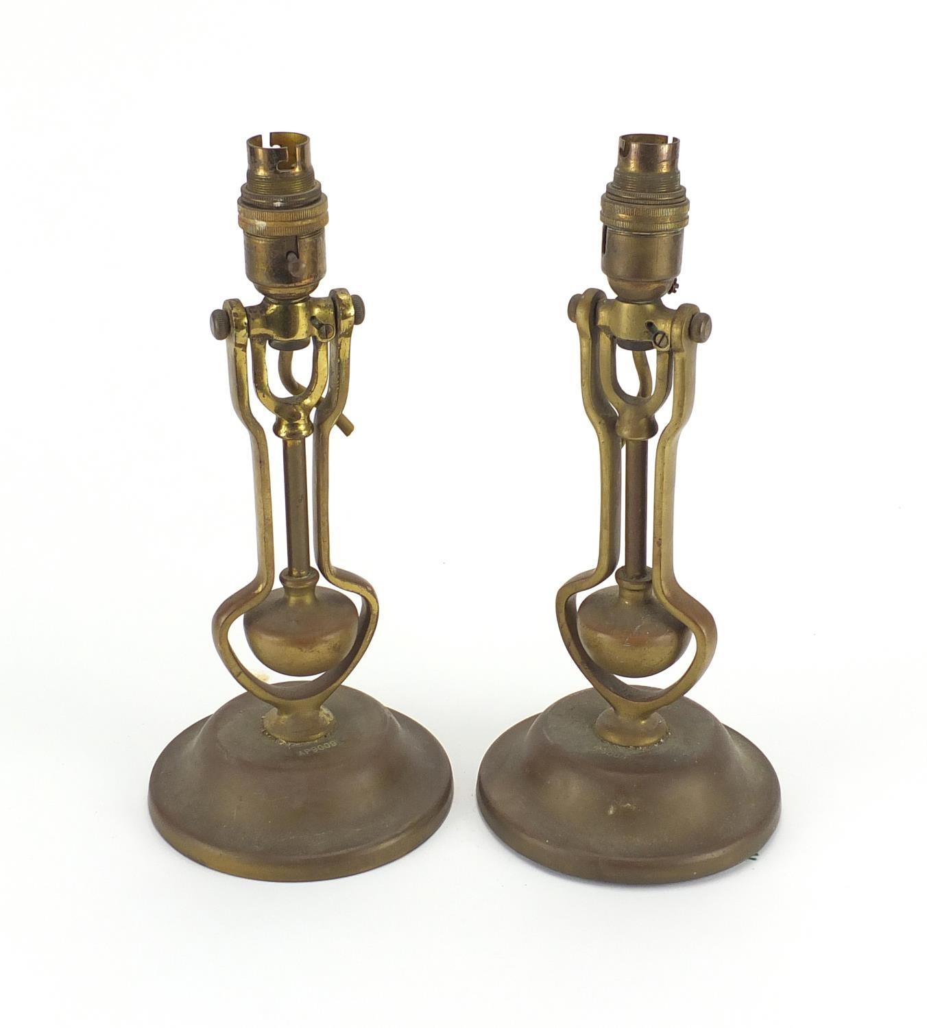 Pair of Playmit brass gimbal lamps, impressed AP9009 to the bases, each 31cm high : For further