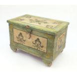 Dowry style trunk with twin carrying handles, hand painted with flowers, with wooden wheels, 53cm