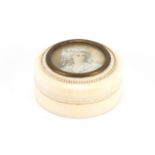 Circular ivory box and cover, the lid with a hand painted portrait miniature of a female, 6cm in