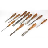 Steel bladed carpenters tools comprising three chisels and eight gauges, including Buck & Ryan : For