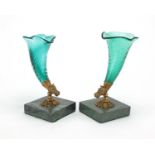 Pair of Cornucopia glass vases on square marble bases, with gilt horse head mounts, each 15cm high :