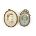 Two oval hand painted portrait miniatures one of a lady and one of a young girl, both housed in