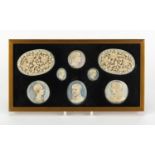 Six carved ivory portrait panels together with a pair of Chinese Canton panels carved with flowers