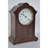 An Edwardian mahogany mantle clock having a cylind