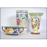 Ceramics to include a vintage Poole Pottery vase of large form along with two Gouda floral pieces,