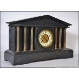 A 19th century large slate mantel clock with 8 day Japy Freres brass movement. The oversized case