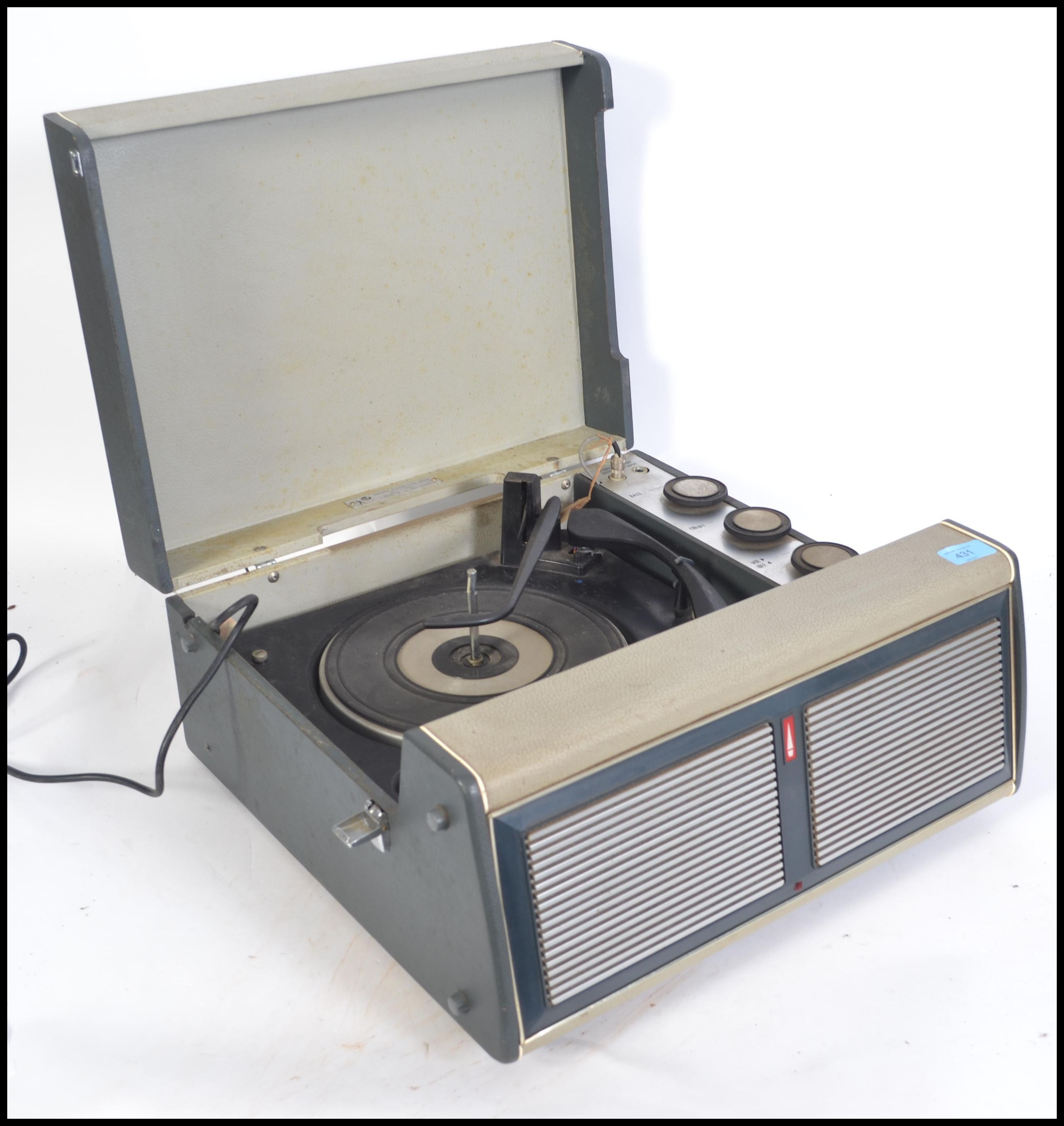 A vintage 1960's Bush portable four speed record player. Having a grey vinyl case with single