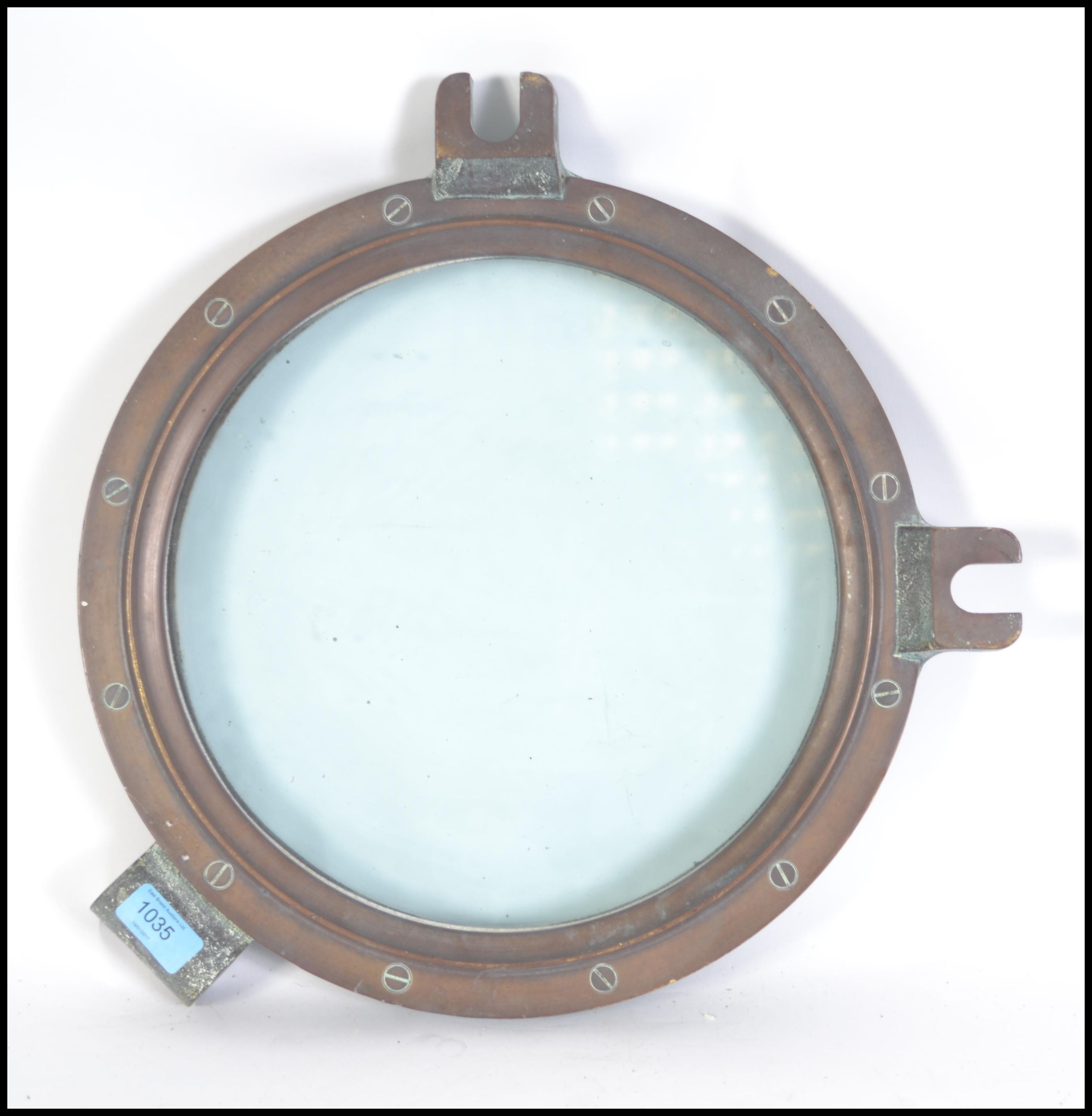 Shipping interest A vintage 20th century industrial brass heavy ships porthole measuring 37cm