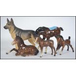 A collection of four Beswick horses and fouls toge