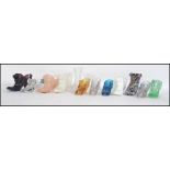 Twelve novelty pressed glass ladies shoes / boots of varying styles and ages Measures 10cms high.