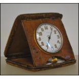 An early 20th century Asprey of London Goliath travel clock set within a crocodile skin case. The